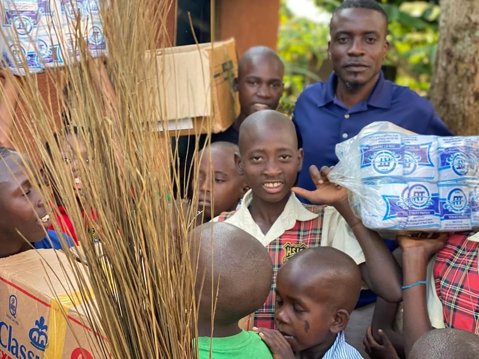 Children smiling after receiving donations
